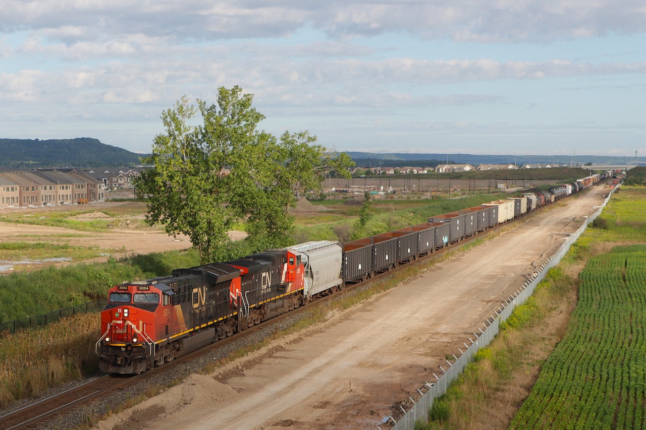 A421 is about to duck under Britannia Road with a "Clear Signal" at Ash and 126 cars stretching into the distance alongside ongoing construction work between Derry and Ash for the future South Track.