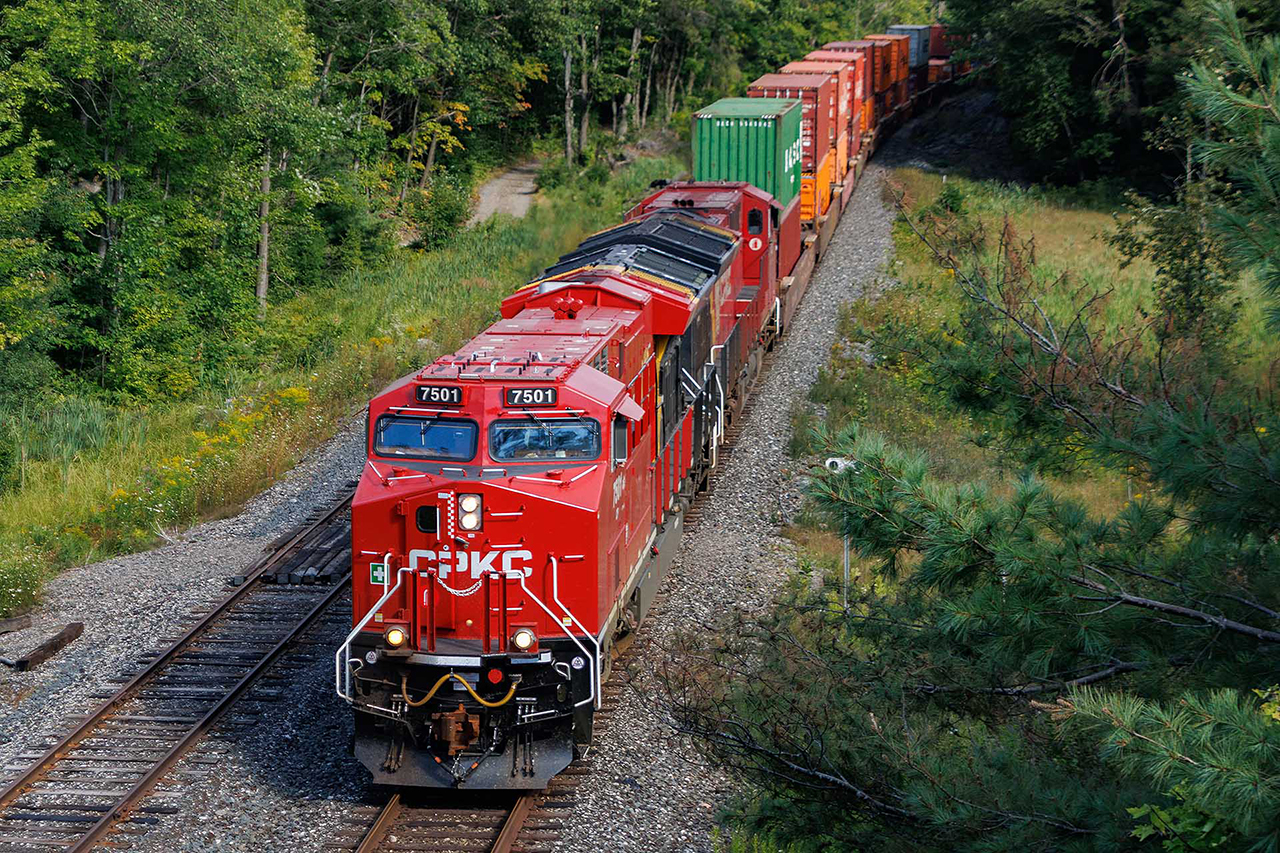 A couple of hours later, my second encounter with 7501. CP has put all the new ones on 100 series trains going west, and they've remained relatively captive to those trains. There are already rumours of quality and performance issues, but at least, they're still clean. 113 passing under Highway 169 bound for Vancouver.