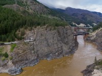 CN G 83451 21 rolls east on the CPKC Thompson Sub, as CPKC 301-230 heads west on the CN Ashcroft Sub at Cisco. 

CN G 83451 21: CN 2825, CN 2891, CN 3148 - DP 2x0x1 - 150 

CPKC 301-230: KCS 5022, KCS 4774 - DP 1x0x1 - 128 cars