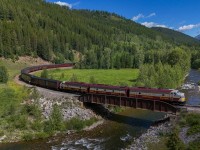 CPKC 31B-25 works through the horseshoe curve at Fabro, as they march up towards the Continental Divide at Crowsnest Pass.