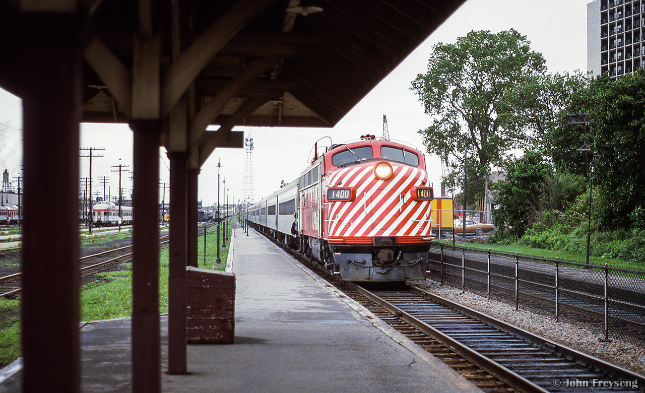 Passing the old CP Glen Yard facilities, CP 1400 brings an eastbound train to a stop at Westmount station.

Scan and editing by Jacob Patterson.