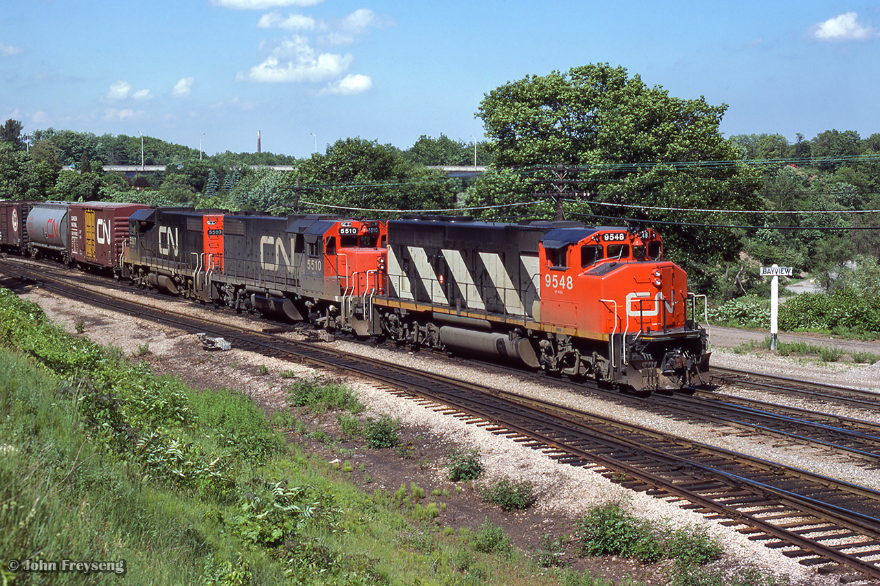 A Niagara-bound freight for Fort Erie passes through Bayview Jct, crossing over to the north track.

Scan and editing by Jacob Patterson.
