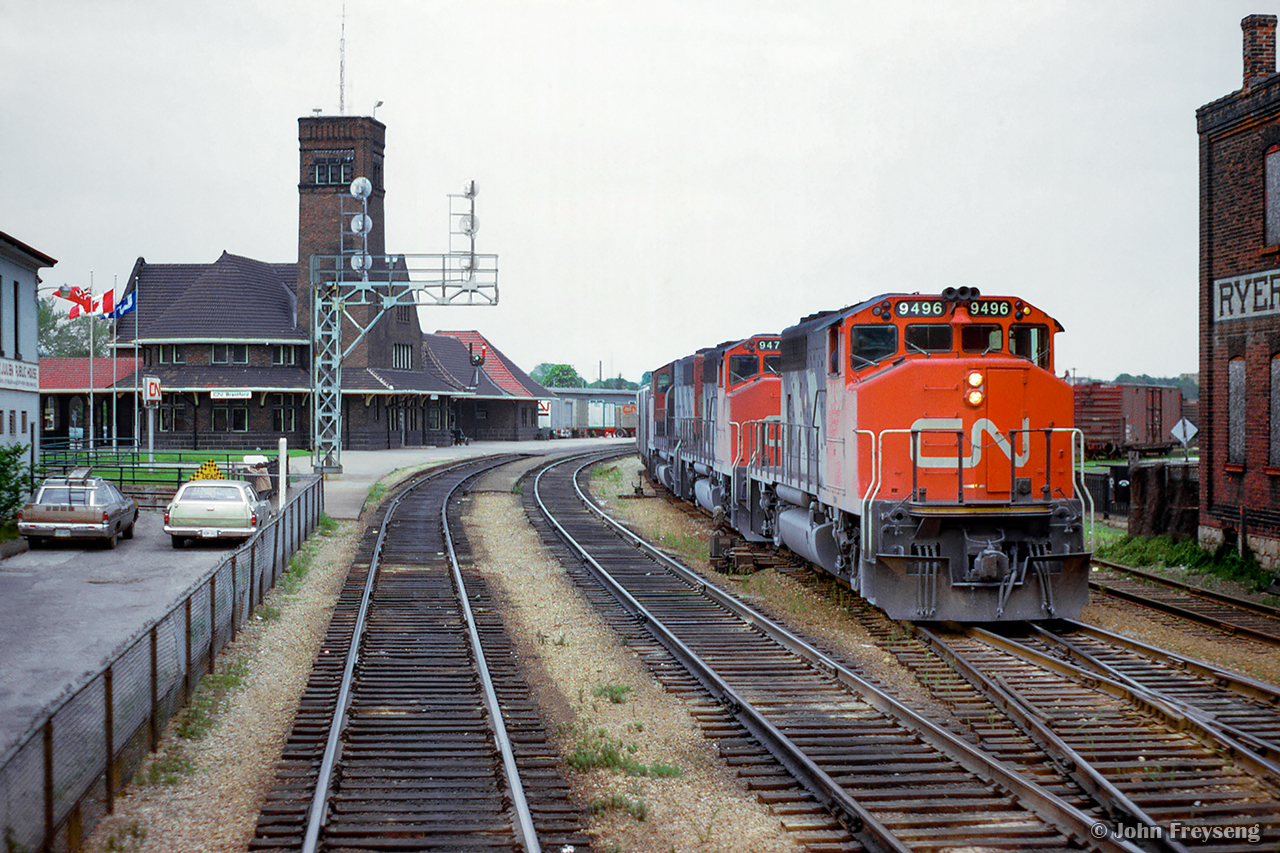 From the rear of an eastbound train, a triple set of GP40-2LWs work the yard at Brantford.

Scan and editing by Jacob Patterson.