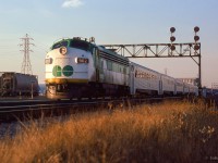 An early morning GO train is seen eastbound entering CN's Kingston Sub at the end of Toronto Terminals Railway territory. Approaching the Don River en route to Pickering, the train passes Don Yard at left, today used by GO Transit as a layover facility.
<br><br><i>Scan and editing by Jacob Patterson.</i>