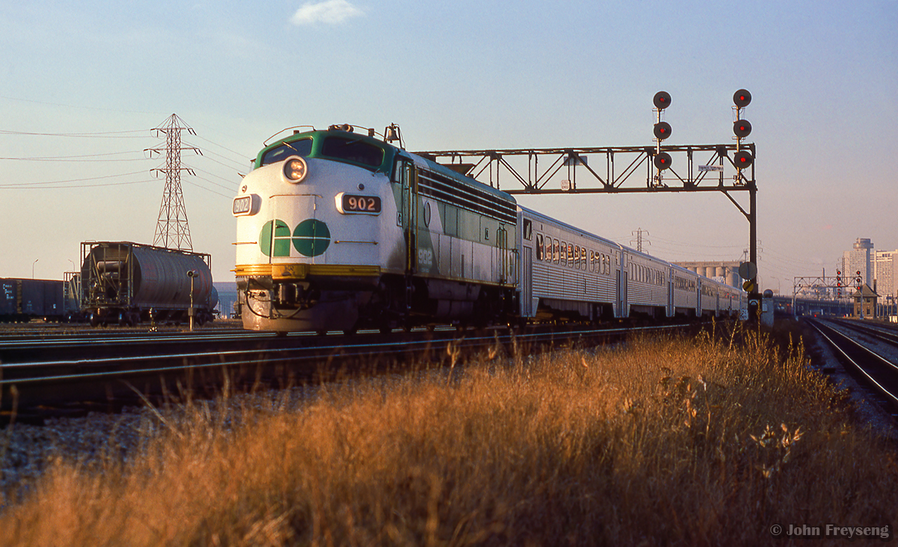 An early morning GO train is seen eastbound entering CN's Kingston Sub at the end of Toronto Terminals Railway territory. Approaching the Don River en route to Pickering, the train passes Don Yard at left, today used by GO Transit as a layover facility.
Scan and editing by Jacob Patterson.