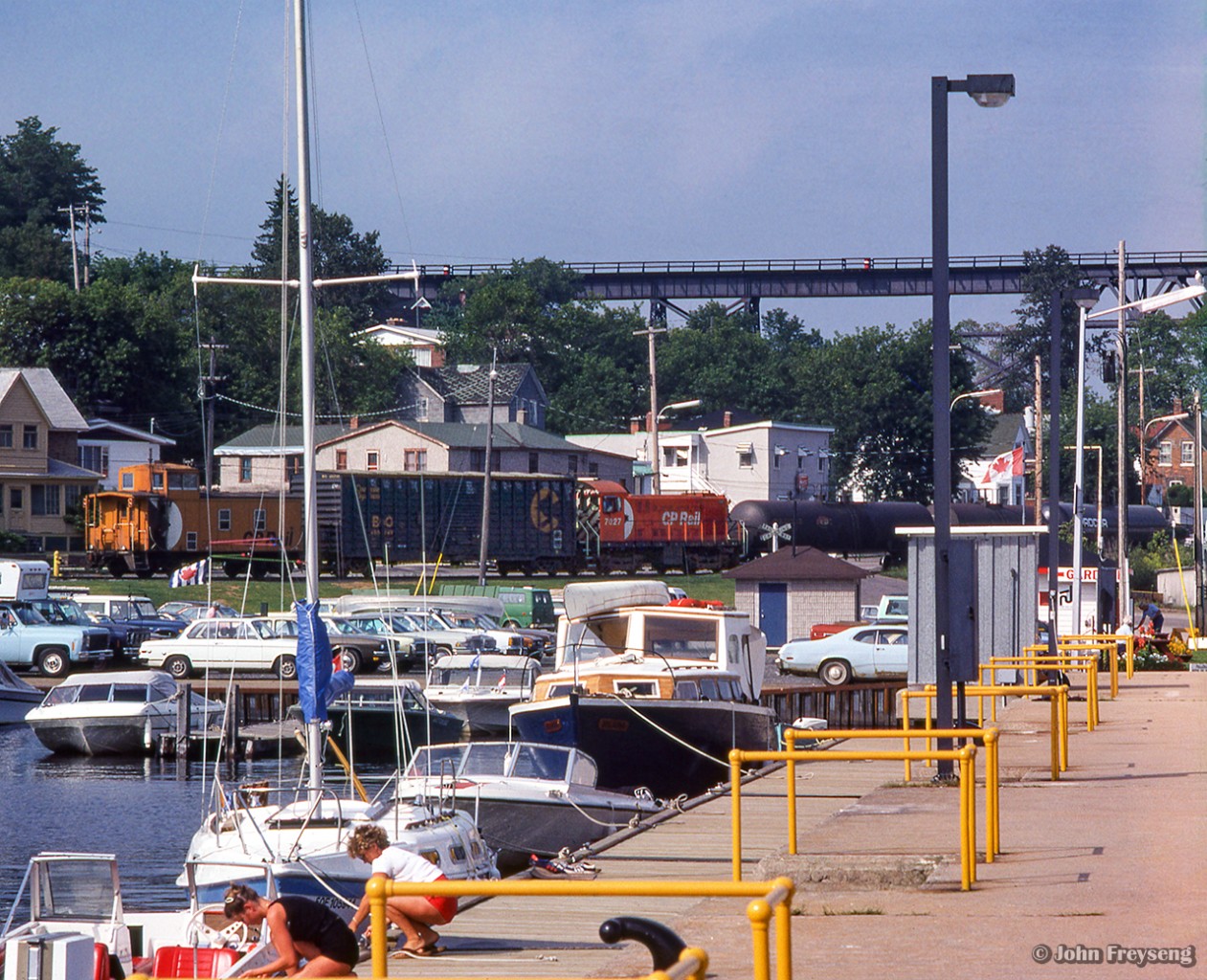 Making their evening appearance on the shared industrial trackage in Parry Sound, CP ALCO S2 7027 moves cars around on the waterfront.

Arnold Mooney captured two CN scenes on this spur in June 1979.  Moving tank cars from one of the three fuel dealers (Shell, Imperial Oil, and Ultramar,) and running around their van.


Scan and editing by Jacob Patterson.