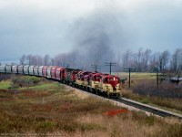 Four TH&B units, assisted by a pair of CP C424s take a phosphate rock extra upgrade at Vinemount.

<br><br><i>Bill McArthur Photo, Jacob Patterson Collection Slide.</i>