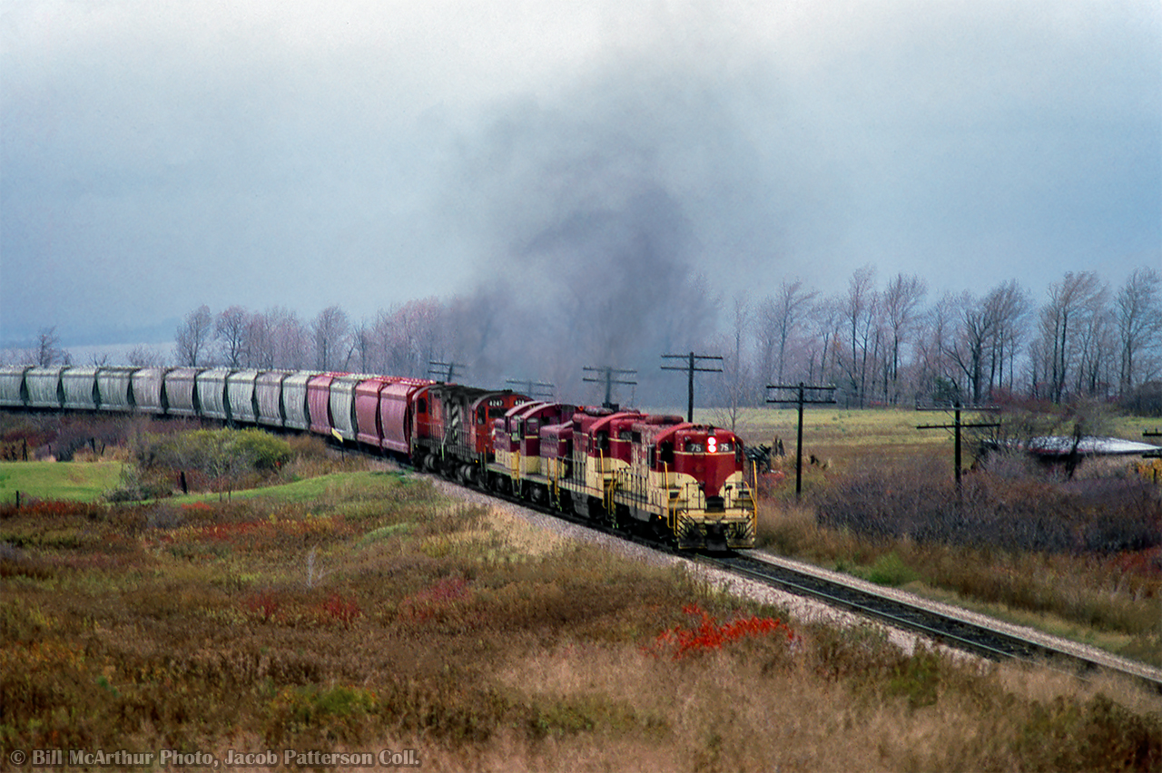 Four TH&B units, assisted by a pair of CP C424s take a phosphate rock extra upgrade at Vinemount.

Bill McArthur Photo, Jacob Patterson Collection Slide.