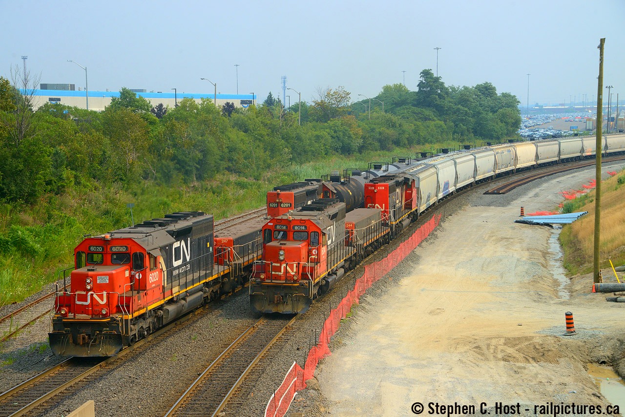 Back last year in March we had a lively discussion over IC SD40-2's in Canada. This one has been here off and on for years, in Toronto toiling away in relative obscurity. Sure it doesn't have IC paint, but not only that, these SD40-2's which would sent the community into a frenzy on the mainline, toil from public property almost 24 hours a day without much of a care except for a few folks. Sometimes you get lucky and a pair of hump sets pass in front of you with a sound that reminds you why you like this hobby. There are about 6 SD40-2's assigned to hump service and they do rotate in and out but it's usually the same ones. Last week it was CN 6020, 247, IC 6201 pictured blasting down the north  hump lead passing 6014, 244, 5328 which was reversing trimming their cut. Notice the construction, there's a new lead going all the way through here along with a new "mainline" going in on the west end of Mac Yard to the new Fuel transload facility. There are also very few 500 series slugs in service these days.