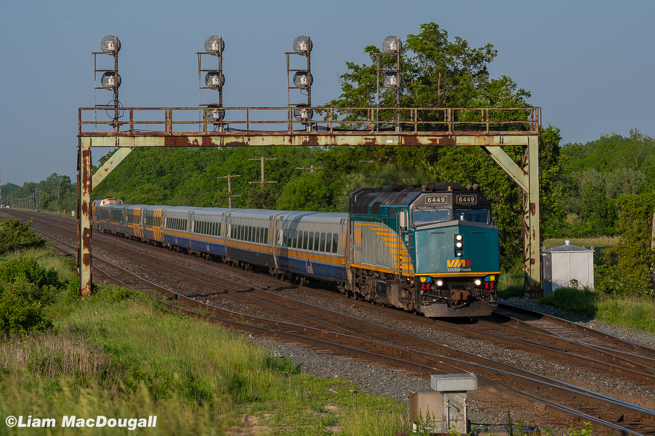 VIA 6449 leads a push-pull set of 8 LRC cars on train 75 as they duck under the signal bridge at Paris West in some nice evening light.