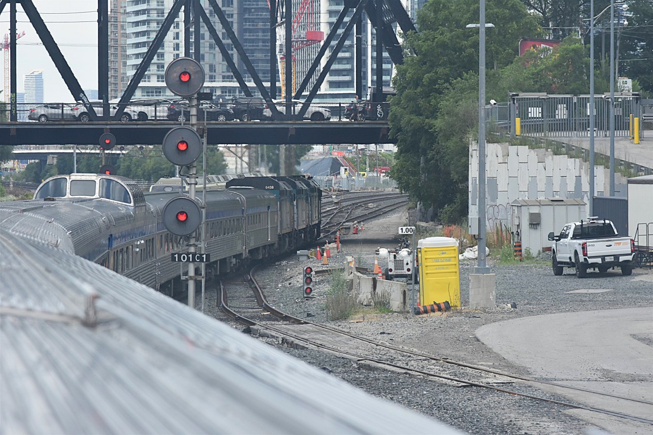 Let the Journey Begin!  
VIA 001 The Canadian begins another westbound journey across Canada as units VIA 6415, VIA 6432, and VIA 6438 pull the departing consist out of Union Station and pass under the Bathurst St., bridge at Mile 1.0 USRC Weston Sub. Toronto, ON this very pleasant July 30, 2025 morning.