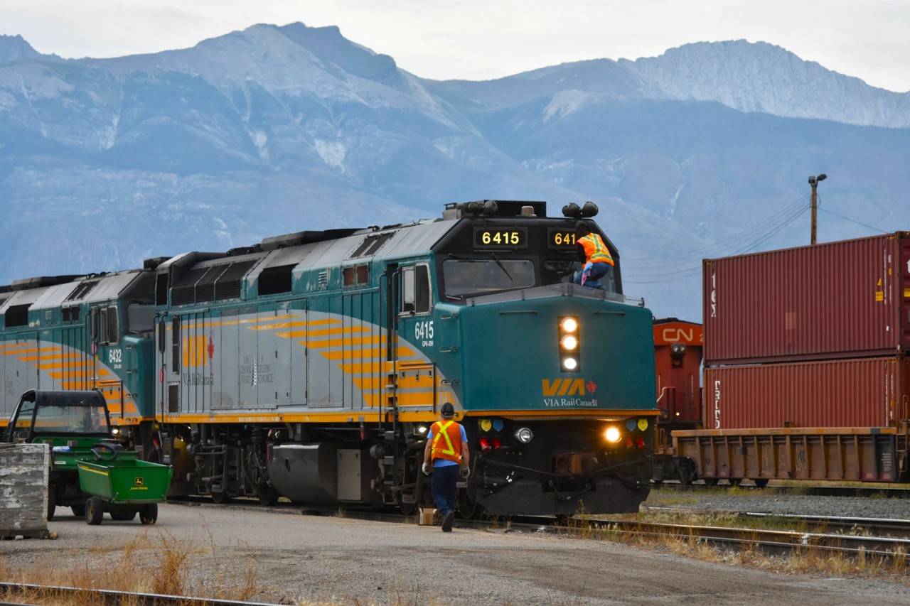Getting some TLC  
VIA 6415 is on the point of VIA 001 The Canadian at Jasper, AB Mile 0.0 CN Albreda Sub. on August 2, 2025, and is getting a little Tender Loving Care from VIA Rail maintenance personnel during the trains stop in the historic town. 
Front windshields are getting a thorough cleaning, and a replacement right side ditch light is about to be installed. 
When arriving as scheduled, the early morning 3-hour stop allows plenty of time for a walk around town, and for some great railroad photography. :-)