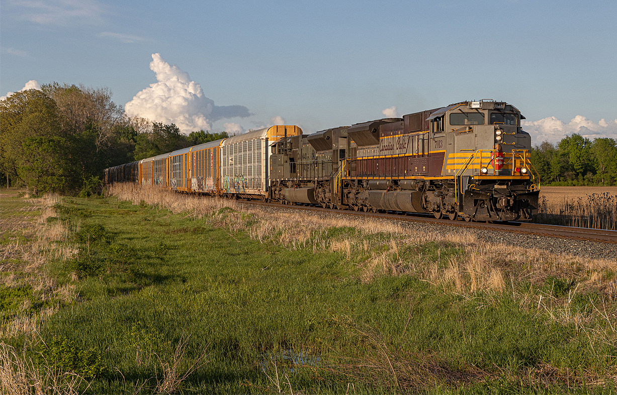 CPKC 231 heads west towards Glencoe on the Windsor Sub with a memorable duo of Heritage ACU 7013 and Military tribute ACU 7020 back to back.  I haven't seen one of these duos since 2020 with 7016 and 6644.  Quite the wait for this one, but it was all worth it in the end with the sun relaxing low in the sky to give a nice view of a unique consist.  Some homemade number boards on 7013.