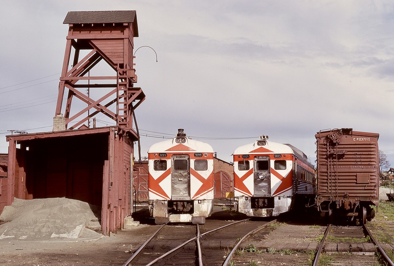 On the E&N on Vancouver Island, a single RDC was normal for passenger service from Victoria to Courtenay and return daily except Sunday, with exchanges for mainland cars occasionally required to handle heavy maintenance needs such as truck exchanges.  Such a transition is shown on Thursday 1973-05-03, with CP 9199 having just arrived on the shoptrack off No. 2 from Courtenay and CP 9105 from Calgary after arriving dead in transit on early morning freight No. 52.  The next day, No. 1 was run with CP 9105, and CP 9199 went dead in transit on freight No. 51 to the mainland barge connection from Nanaimo.  The reverse transition took place on 1973-05-29 and -30.

This photo provides a comparison of the National Research Council experiment with a revolving beacon over the twin-sealed-beam headlight on CP 9199 and the standard Pyle Gyralite on CP 9105.  For me, the Gyralite was the more effective for conspicuity, and when the beacon was removed on CP 9199 on 1975-01-05, I was quite happy to return to the need to relocate the Gyralite from the south end to the north each evening after No. 2 had arrived.