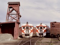 On the E&N on Vancouver Island, a single RDC was normal for passenger service from Victoria to Courtenay and return daily except Sunday, with exchanges for mainland cars occasionally required to handle heavy maintenance needs such as truck exchanges.  Such a transition is shown on Thursday 1973-05-03, with CP 9199 having just arrived on the shoptrack off No. 2 from Courtenay and CP 9105 from Calgary after arriving dead in transit on early morning freight No. 52.  The next day, No. 1 was run with CP 9105, and CP 9199 went dead in transit on freight No. 51 to the mainland barge connection from Nanaimo.  The reverse transition took place on 1973-05-29 and -30.

<p>This photo provides a comparison of the National Research Council experiment with a revolving beacon over the twin-sealed-beam headlight on CP 9199 and the standard Pyle Gyralite on CP 9105.  For me, the Gyralite was the more effective for conspicuity, and when the beacon was removed on CP 9199 on 1975-01-05, I was quite happy to return to the need to relocate the Gyralite from the south end to the north each evening after No. 2 had arrived.