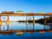 With the last bit of light for the day 7012 slows to a stop over the Trent River to wait for an approaching westbound.