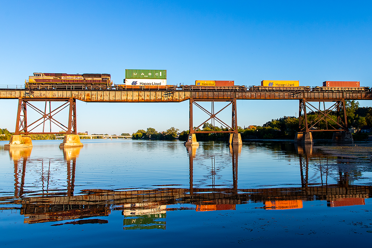 With the last bit of light for the day 7012 slows to a stop over the Trent River to wait for an approaching westbound.