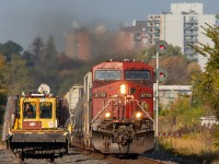 MOW equipment waits for an eastbound to pass through downtown Belleville before they enter the main.