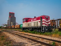 Sitting in the grass in Craik Saskatchewan... Waiting for the next job...