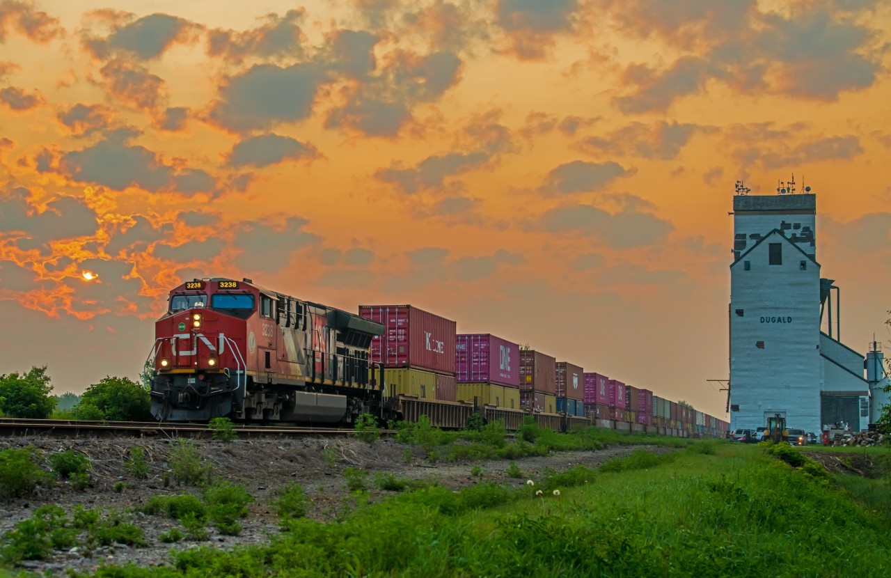 CN 3238 is leading their intermodel train through Dugald Manitoba just after sunrise. They are now on the final stretch into Winnipeg.