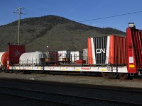<b> CN Poseidon </b> <br>
CN 100004 bulkhead flat is part of CN's Poseidon Fire Fighting consist and is resting at their Kamloops, BC yard Mile 139.4 Clearwater Sub. on a beautiful April 30, 2025 evening. <br>
I captured this and several other cars of the special service train during a scheduled stop of VIA 001 The Canadian. <br>
There is always so much to see when traveling across Canada by train. :-)