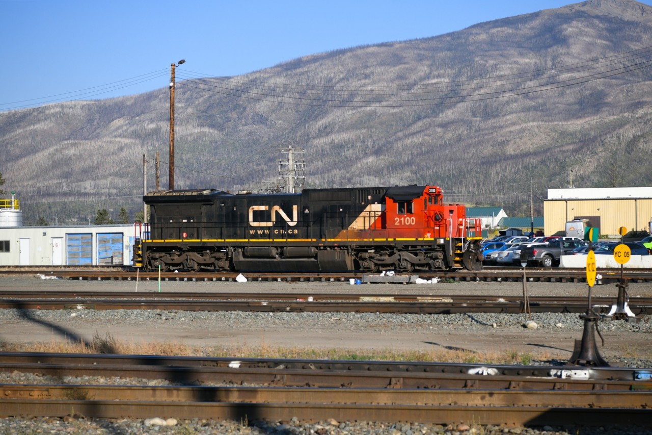 <Familiar sight  
For the past several years, each time I visit or roll through Jasper, CN 2100 has been parked in the yard just east of the CN Operations building. 
Most times it is sitting idle, however, on occasion I have seen trainees out learning some skills that will help get them qualified for train service. 
That was not the case on this beautiful afternoon as CN 2100 basked in the warm sunshine under a clear blue sky. :-)