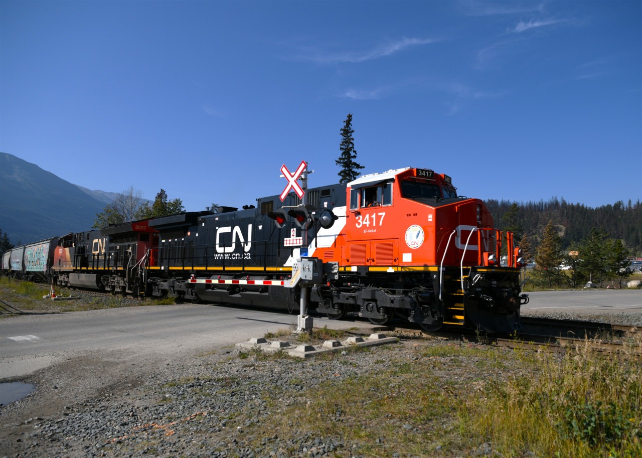 Hey, that's not a new locomotive  
CN 3417 (nee-CN 2594) has a new crew on board and is rolling slowly across Hazel Avenue at Mile 0.29 Albreda Sub. at the west end of CN's Jasper Yard on September 16, 2025. 
The on-board crew were super friendly with their horn, waves, and information on what appeared to be a 'new' unit. :-)