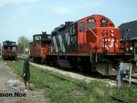 During a Saturday evening, CN GP9RM 4111 with caboose 79817, along with GP9RM 4109 and caboose 79513 await their next assignments in Kitchener, Ontario. Unlike today, during the mid-90’s the Kitchener-based CN locals rarely worked on the weekends, so power was easily shootable across from the VIA Rail station.  