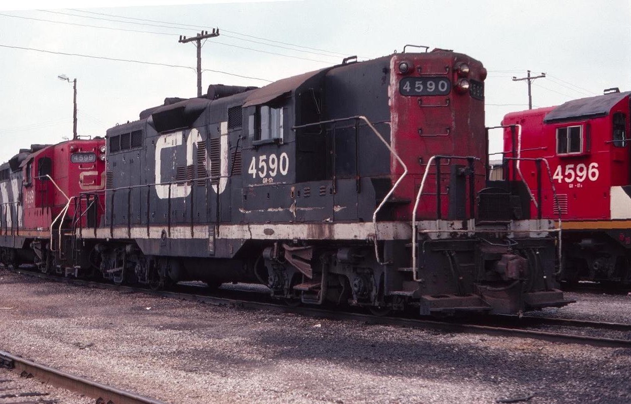 On the way to a Toronto vacation in July of 1982, including Blue Jay's baseball games and Lichee Garden for dinner, I somehow convinced Dad to stop at the CN Niagara Falls Yard, where local power was usually gathered. This photo shows CN GP-9 4590 parked near the yard office. Not much remains there today, that's for sure!