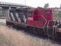 CN hi-nose Geep 4592 is seen at the former CN Niagara Falls yard near the yard office in August of 1982. The Victoria Avenue overpass is in the background. I was very surprised to come back years later and find the yard gone. This reminds us all to get pictures while we can, because time marches on! 