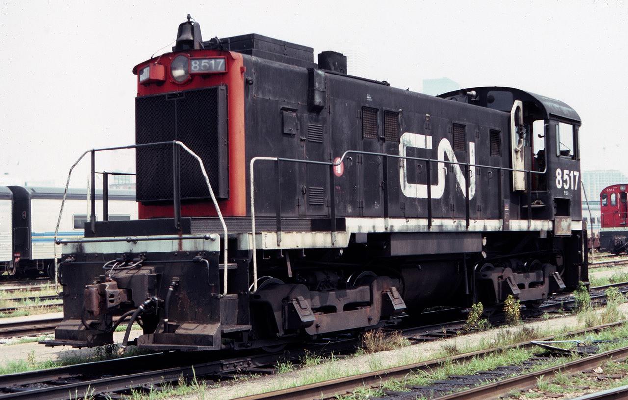 Those old CN "Alco" S-13 switchers seemed to last forever, until they didn't! This August 1983 view shows CN 8517 resting in the coach yards near Toronto Union Station.  Note the footboards, and those old-style journal lids for the friction bearings!