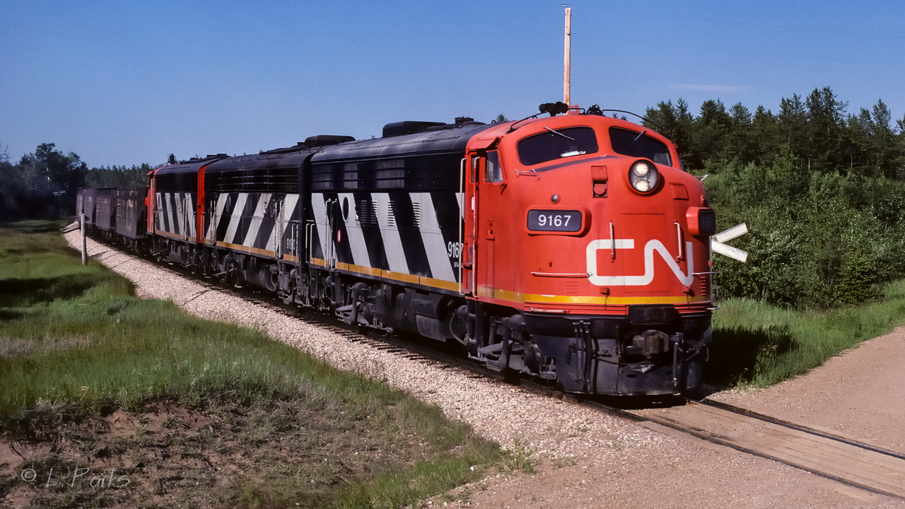 Nice sunny weather the morning before when this unit train went north as the 9171, 9190 & 9167. Ditto the weather at 18:30 the next day as it returned home. It made photographing the f units a delight. It had 36 sulphur loads coming around the bend to the hamlet of Coronado. On the tail end next to caboose 79286 was a scale test car (number unknown).