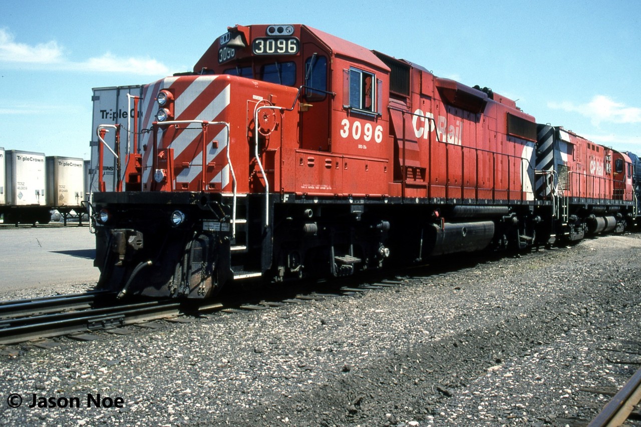 During a weekend afternoon, CP GP38-2 3096 and Control Cab 1102 wait between assignments at CP’s Lambton Yard in Toronto, Ontario. 1102 was built as C-424 4213 during 1965 and was converted into a control cab in early 1995, eventually being paired with 3096. It was sold to Quebec Railway Corporation in March 2004 and following a rebuild by Industrial Rail Services in Moncton, New Brunswick, it was acquired by the Pennsylvania-based West Chester Railroad in 2010.