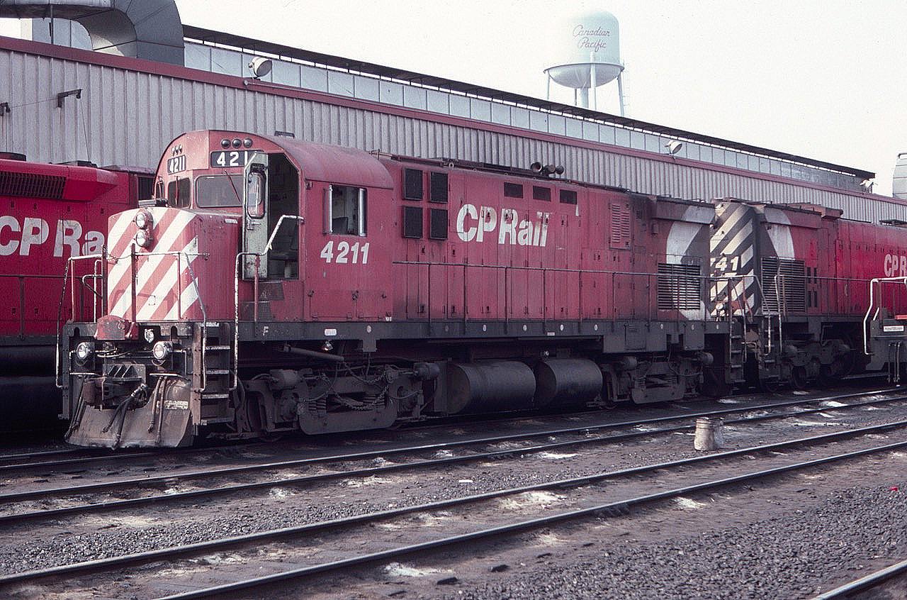 Back in the good old days when Alcos still roamed the earth, or at least Canada. CP 4211 MLW C424 is seen at Agincourt Diesel Terminal in August of 1983. Note the CP water tower.