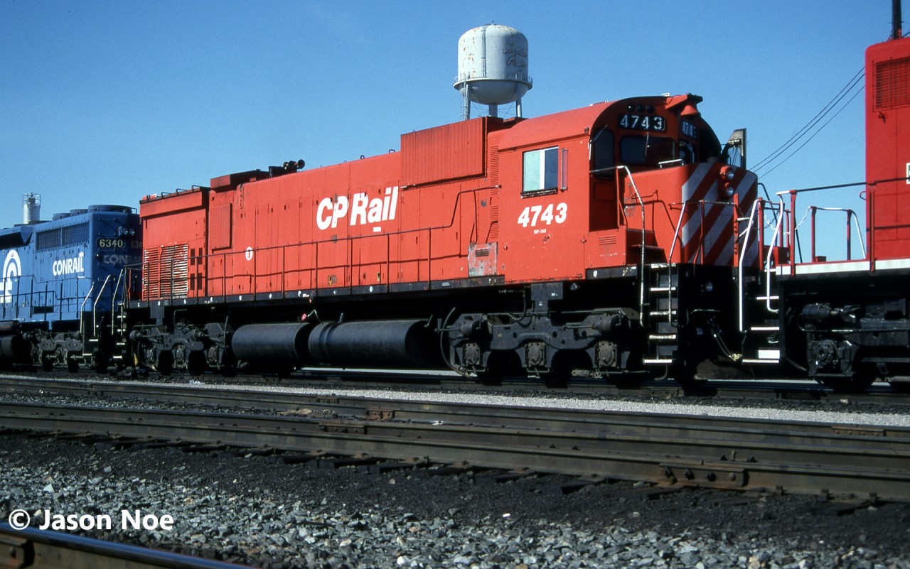 During spring 1994, CP had re-activated 33 big MLW’s from retirement, which included a mix of C-630M’s, M-630’s and M-636’s. By winter 1995, only 27 remained active, some of which had their cab windows boarded over as they were mainly trailing units only. By 1995 as the months ticked by, their numbers would shrink less and less as they were retired following major failures. Also, by spring 1995 CP had a group of rebuilt SD40-2’s delivered from Morrison–Knudsen. Plus, the railway had their first order of GE units ever, in the form of 83 new AC4400CW’s due for a late summer arrival. Additionally, the railway would go on to purchase several yellow GATX SD40-2’s that they were leasing. All these acquisitions would ultimately see all the Big M’s retired by the end of August 1995. 

Here, CP M-636 4743 is viewed at CP’s Toronto Yard in Scarborough, Ontario along with leased Conrail SD40 6340. The Conrail unit would eventually be acquired by Helm Leasing and became HLCX 6064. The big MLW was eventually retired a few months later on August 28 and was sold to the Delaware-Lackawanna Railroad in 1997.