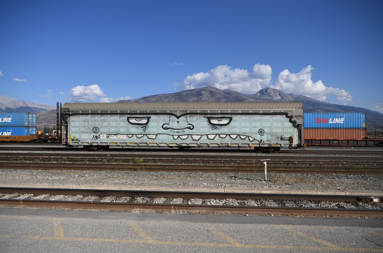 A big smile from Jasper  
Just got home from a round trip on VIA 006 & 005 The Skeena this past week. 
The weather was spectacular on both days I spent in Jasper, and my smile was as big as the one on this CP auto rack that was parked in the CN yard.