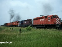 After a meet with SOO 6621 west (train 503) at Wolverton, Andy and I waited at the crossing for the conductor of 5527 east to turn the switch after they received their clearance to depart the siding following the meet. Within a couple minutes, M-636’s 4742 and 4743 put on a smoky show, exiting the siding, trailing SD40 5527 and HLCX SD40 5008. Their thick black exhaust lingered in the humid air, as the eastbound increased speed and clattered out on the main. A mainline both M-636’s called home for decades.  Fittingly just like that it came to be that was the last time I ever saw a CP big alco in active service as the pair were shut down and retired later that summer. 
