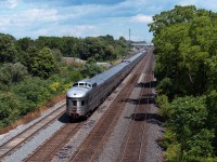 RARE TO SEE: On the morning of August 24th, 2025, CN double stacker Q107 derailed at Doncaster, taking multiple tracks out of service on both the Bala and York Subdivisions, conveniently right before VIA no.1, the Canadian, was set to depart Toronto's Union Station on schedule at 0955 hrs. The Q107 derailed on the northwest quadrant of the Doncaster diamond, which is the same connector that VIA needs to be able to reach the Bala after using the MX Newmarket and York Subdivisions on their way out of the city. 

As luck would have it, Snider Sunday was in effect at Snider West when we got word of no.1 using the Oakville Sub...beyond Mimico Toronto Maintenance Centre. This gave us the notion the train A) was not cancelled and still very much in service, and B) was likely utilizing the entire Oakville Sub to reach Bayview Jct, the idea being no.1's crew would wye at Bayview and travel all the way back east, bypassing Union station, and climbing up the Don Valley to get back on track for their trip, albeit four hours later than originally intended.

VIA 88709, the observation dome park car 'Laurentide Park' brings up the tail end of the Canadian, seen here cruising eastbound under Lemonville Rd, approaching Aldershot on a bright and sunny afternoon.