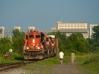 While I could have got the EJE unit leading CN 321 in nice light on this evening, I went with CN 7017 leading CN YRP003 on a scorching day. Here conductor NH bends the iron before the train heads to Getpaq with two boxcars, where they will also lift five boxcars. Behind was once CN's Longue-Pointe Yard, now out of use for well over a decade.