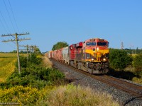 Thundering across the fields, CPKC 134 approaches the crossing at 43rd line east of Zorra.