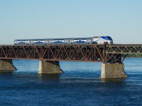 EXO 1328 leads EXO 76 from Candiac as it crosses the St. Lawrence River and approaches the next stop at LaSalle Station.