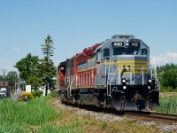 CN 591 is returning from Soulanges Rail Industries with five cars coming out of storage as it prepares to back into the yard at Coteau with IANR 4100 leading. It has just left the Kingston Sub and is pulling towards the Valleyfield Sub.