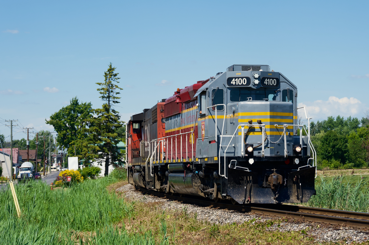 CN 591 is returning from Soulanges Rail Industries with five cars coming out of storage as it prepares to back into the yard at Coteau with IANR 4100 leading. It has just left the Kingston Sub and is pulling towards the Valleyfield Sub.