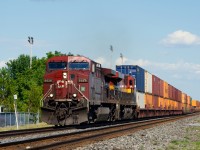 CPKC 133 is on the sole remaining non-CTC portion of the Winchester Sub as it blasts through the small town of Saint-Clet.