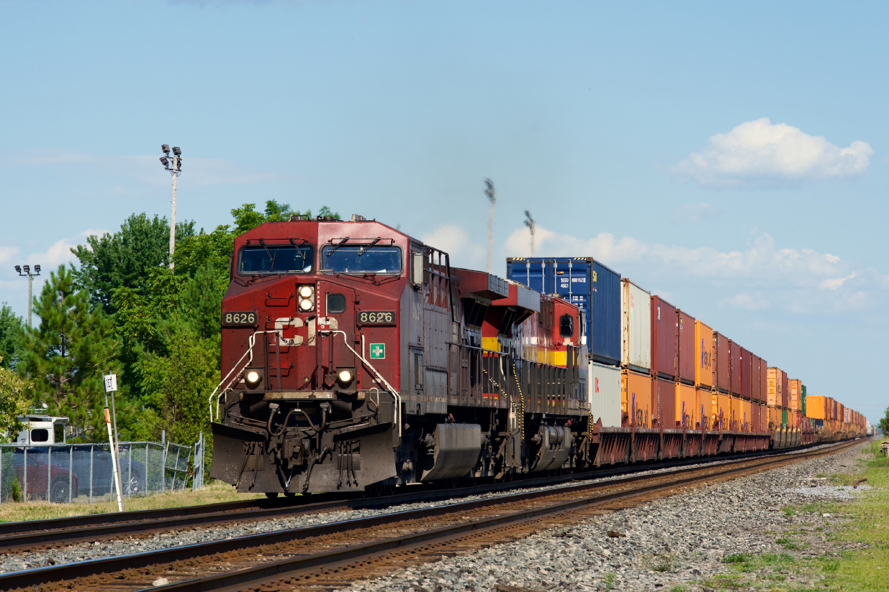 CPKC 133 is on the sole remaining non-CTC portion of the Winchester Sub as it blasts through the small town of Saint-Clet.
