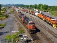 Toronto-Halifax stacker CN 120 passes Southwark Yard as SLR 520 puts its eastbound train together with an SD70MAC pair
(SLR 4024 & SLR 4023).