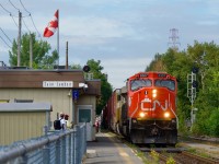 CN 8307 leads CN 324 past the Saint-Lambert Station, on its way Vermont. This train only runs three days a week outside of winter months.