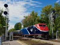 Repainted AMTK 115 on the <i>Adirondack</i> arriving at Saint-Lambert Station.