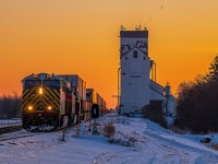 As the winter was slowly ending in Southern Manitoba. CN 2795 leading the way through the siding in Dugald Manitoba, and their way into Winnipeg not long after sunrise.