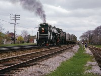 Lined into the small yard at Cobourg, CNR 6167 shoves its excursion consist into the clear in preparation for servicing prior to the westbound run for Toronto.  Today's excursion from Toronto included a stop at Oshawa for traction fans to take in the Oshawa Railway operations which were in the last few years of operation. This day marked the last train down King Street, <a href=http://www.trainweb.org/oldtimetrains/photos/cnr_electric/OR_last_train_street_track.jpg>celebrated by a parade</a> as motor 300 hauled a <a href=http://www.trainweb.org/oldtimetrains/photos/cnr_electric/OR_last_train_street_track_the-end.jpg>single boxcar through town.</a>  Note the empty CPR water tower at left along the CPR Oshawa Sub.  Shortly, 6167 and baggage car will <a href=https://www.railpictures.ca/?attachment_id=53328>head around the wye.</a>


<br><br>Steve Bradley would shoot the special after its westbound departure from Oshawa <a href=http://www.railpictures.ca/?attachment_id=34409>highballing through Port Union.</a>

<br><br><a href=http://www.railpictures.ca/?attachment_id=50782>Arrival at Cobourg</a>

<br><br><i>Tom J. Gascoigne Photo, Jacob Patterson Collection Slide.</i>